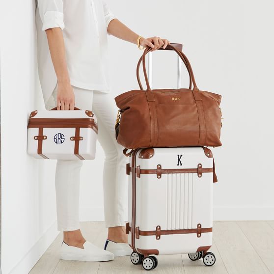 white and tan luggage