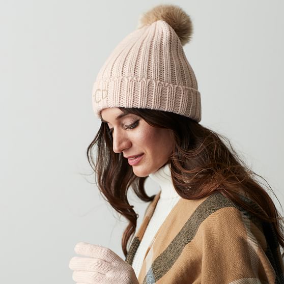 knitted hat with faux fur pom pom