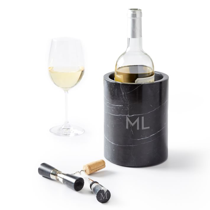 This handcrafted black Marquina marble wine chiller with a custom monogram is the perfect way to keep your favorite wine or champagne cold for your boyfriend