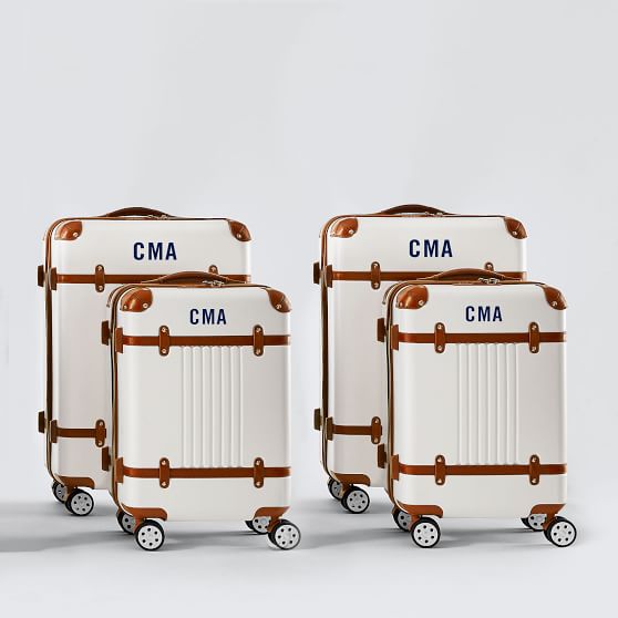 white leather luggage