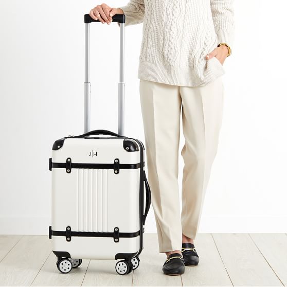 white suitcase carry on