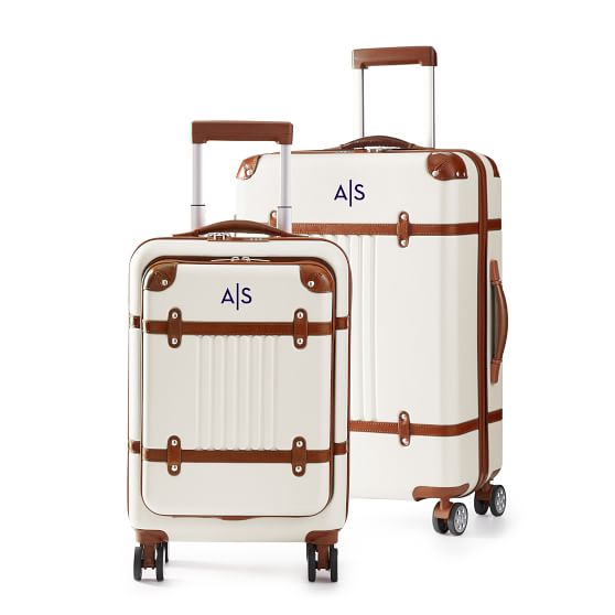 white luggage with brown leather trim