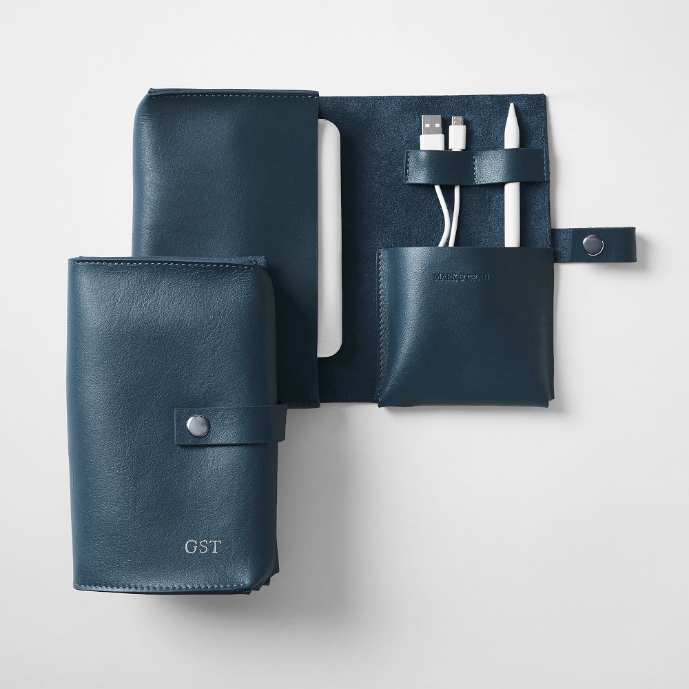Mark and Graham Graham Leather Travel Tech Organizer opened to show cables and earbuds